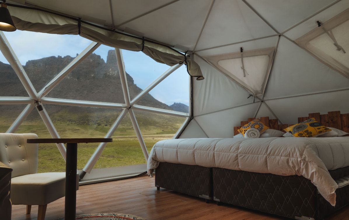 interior of dome at baguales glamping with view of the mountains