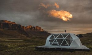 dome at baguales glamping ith mountains in the back at sunset.